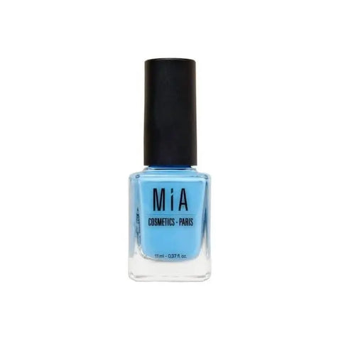 Blue nail polish from Mía Cosmetics Vernis À Ongles Aqua Blue by Jag Couture London New York, showing a glossy nail polish bottle.