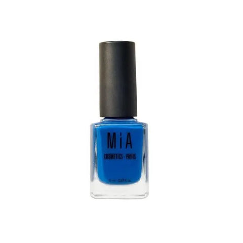 Electric blue nail polish by Mía Cosmetics in a sleek bottle, featuring vibrant blue color and modern design.