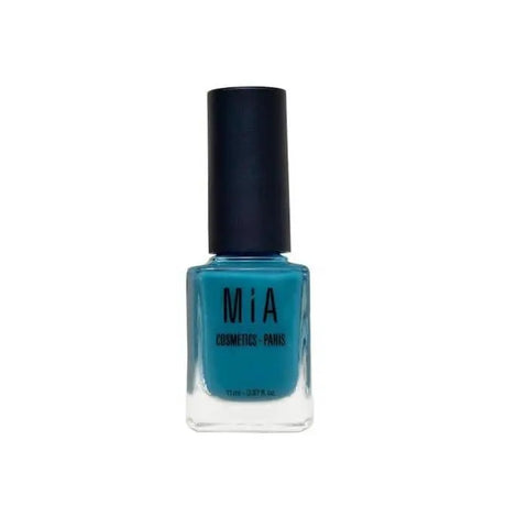 Mía Cosmetics Lagoon nail polish by Jag Couture London-New York, vibrant teal-colored nail varnish on a clear background.