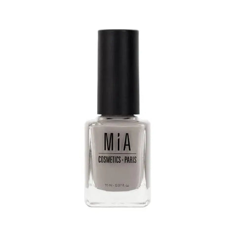 Mía Cosmetics Moonstone nail polish by Jag Couture London New York, featuring a close-up of the shimmering, light-colored nail polish bottle.