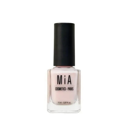 Mía Cosmetics nude nail polish in a clear glass bottle with a black cap, showcasing a soft, natural beige shade.