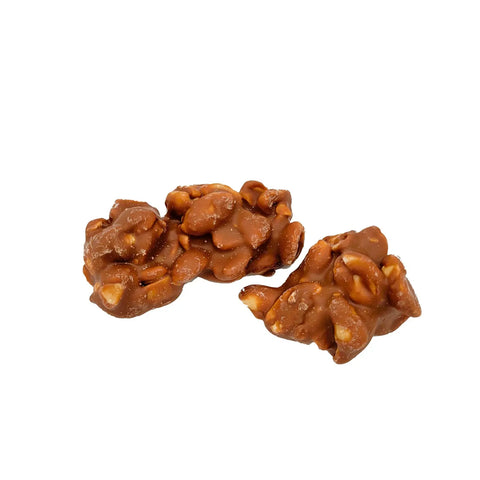 Milk chocolate covered peanut clusters by Jag Couture London New York, showing creamy milk chocolate coating and crunchy peanuts inside.