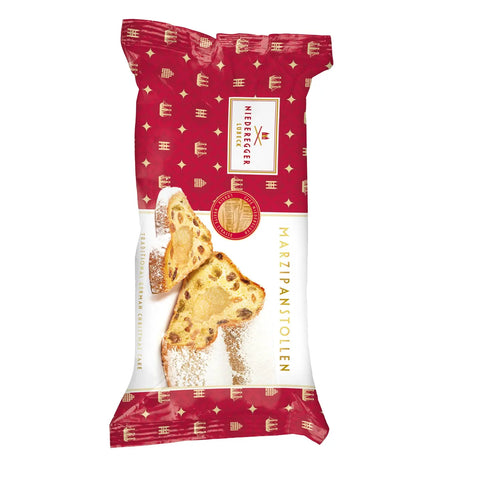 Mini marzipan stollen fruit loaf from Jag Couture London New York, showing a sliced marzipan-filled cake with dried fruits inside.
