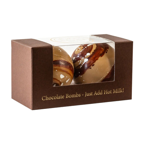 Jag Couture London New York Mr Thoms duo caramel milk chocolate bombs in a gift box, showcasing glossy chocolate spheres.