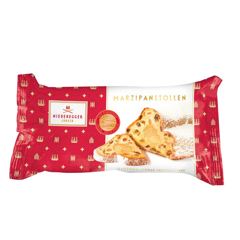 Marzipan stollen fruit loaf with marzipan filling, by Jag Couture London New York, sliced to show fruit and marzipan inside.