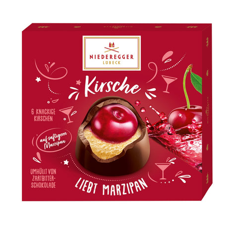 Cherry Loves Marzipan chocolate treats by Jag Couture London showcasing cherry and marzipan enrobed in dark chocolate.