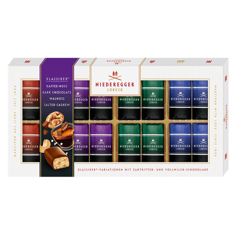 Dark chocolate covered mini marzipan loaves with coffee nut, walnut, and salted cashew in a gift box by Jag Couture London New York.