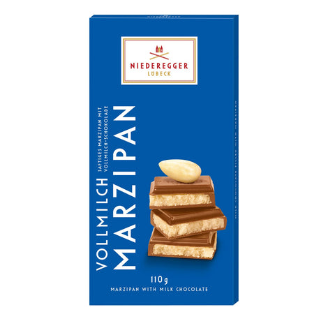 Milk chocolate covered marzipan bar by Jag Couture London - New York, showing a smooth chocolate coating over the marzipan bar.
