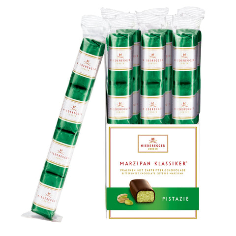 Dark chocolate covered pistachio marzipan bites in flow-wrapped stick pack by Jag Couture London - New York.
