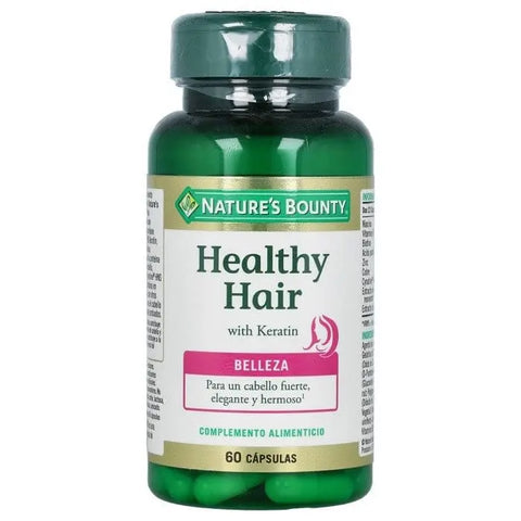 Nature's Bounty Healthy Hair Keratin capsules, 60 softgels, supplement bottle with label, on a neutral background.