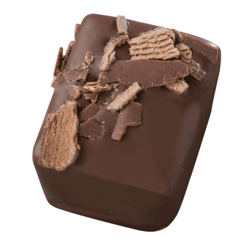 Nero 72% dark chocolate bitter ganache in an 18.4g package by Jag Couture London New York, showing rich chocolate texture.