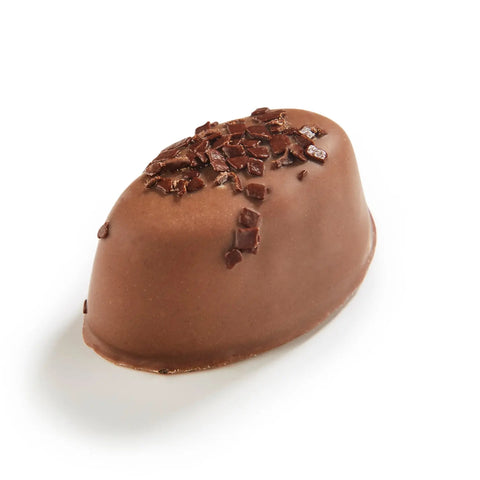 Niek milk chocolate with salted caramel by Jag Couture London New York, 16g, shown with bite revealing caramel filling