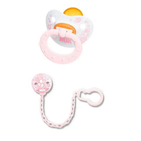 Pink and blue Nuk Soothers T1 in latex for 0-6 months with a matching soother band from Jag Couture London and New York.