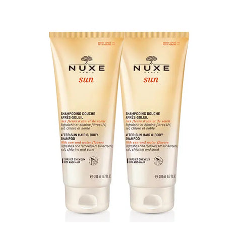 Nuxe Sun After Sun Shampoo for hair and body, 2x200ml bottles, in a natural setting with sunlit background.