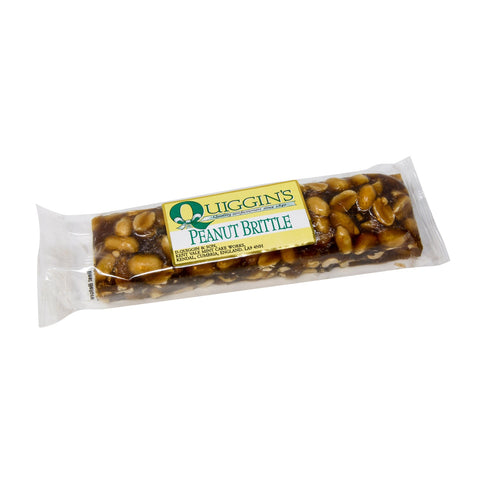 Jag Couture London - New York Quiggin's peanut brittle bar, close-up of crunchy, golden peanut brittle with visible nuts and caramel coating.