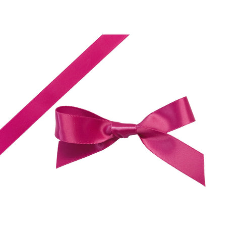 Pink single-faced satin ribbon by Jag Couture London New York, shown draped with smooth, shiny satin fabric and delicate edges.