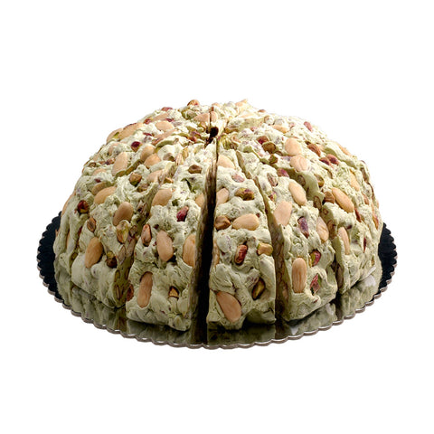 Pistachio flavored handmade soft nougat cake from Jag Couture London New York, showing the creamy, nut-filled dessert with a delicate texture.