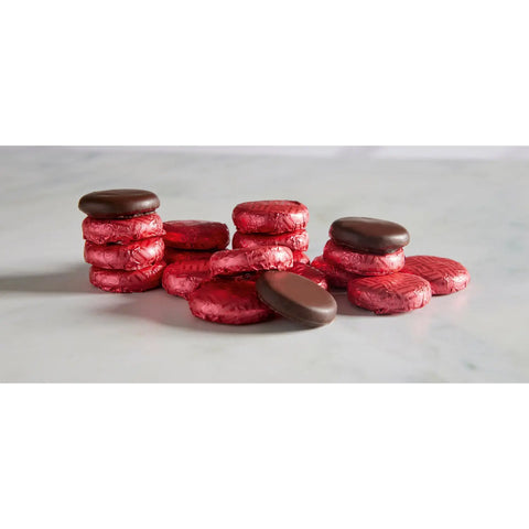 Raspberry crème dark chocolate-covered fondants in magenta foil, 120 pieces from Jag Couture London New York.