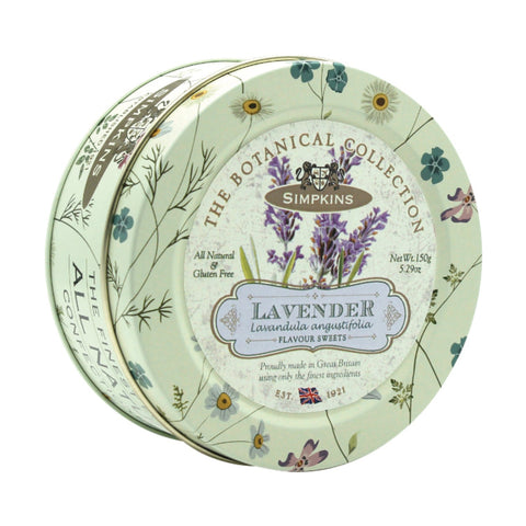 Botanical tin of lavender-flavored travel sweets by Jag Couture London New York, featuring colorful packaging and lavender confections inside.