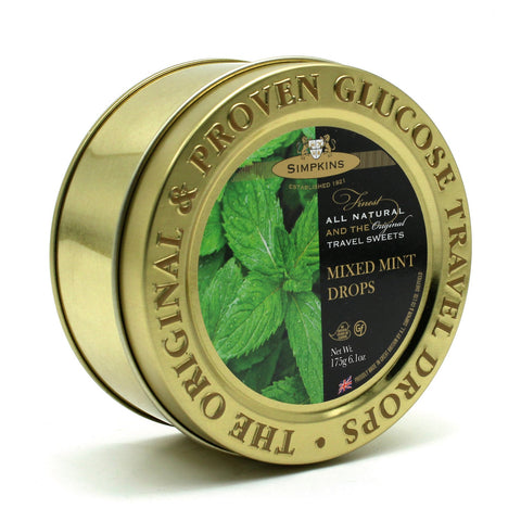 Gold embossed tin of mint flavor travel sweets by Jag Couture London - New York, featuring a decorative tin with colorful mint candies inside.
