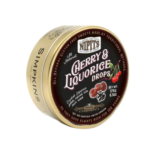 Gold tin of Nipit travel sweets with cherry and liquorice flavors, by Jag Couture London - New York, featuring colorful candies inside.