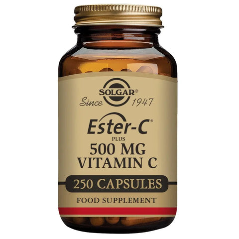 Solgar Ester-C Plus 500mg vitamin C capsules in a bottle, displayed with capsules spilling out, branded by Jag Couture London New York
