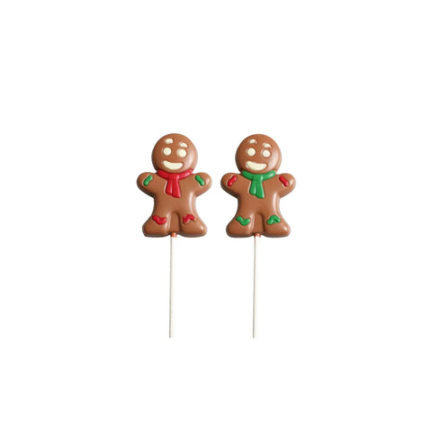 Solid milk chocolate gingerbread person lolly with colorful decorations, from Jag Couture London New York, displayed on a white background.