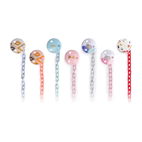 Red round Suavinex brooch pinza by Jag Couture London-New York, featuring a stylish design with a polished finish.