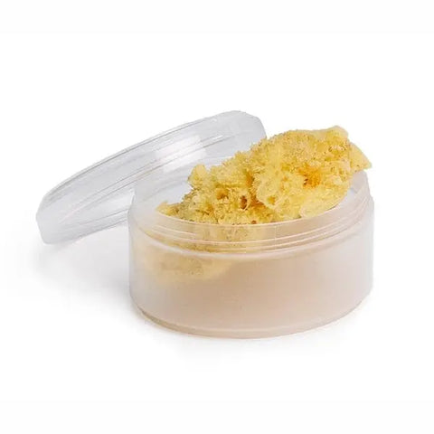 Medium natural sponge from Suavinex, displayed on a neutral background, showcasing its soft, porous texture for skincare or cleaning.