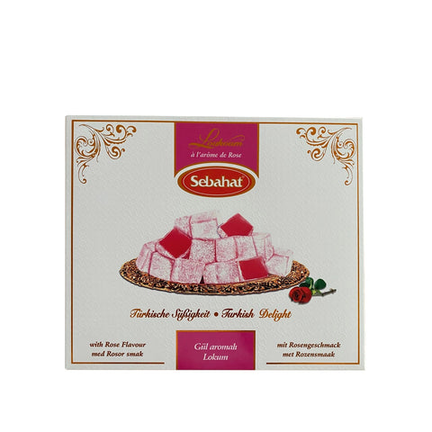 Rose-flavored Turkish delight in a decorative gift box by Jag Couture London New York, showcasing vibrant pink confections.