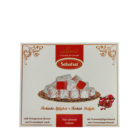 Assorted pomegranate-flavored Turkish delight candies in a decorative gift box by Jag Couture London - New York.