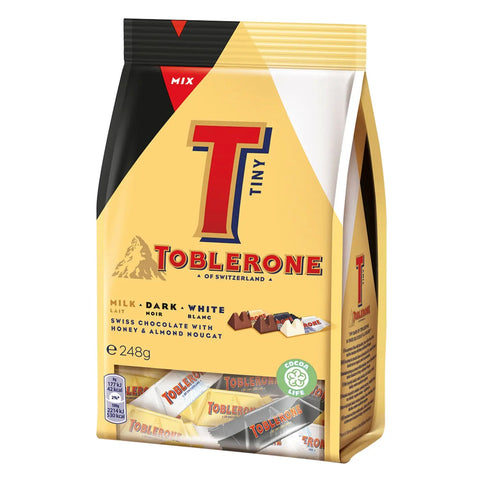 Assorted mini Toblerone chocolate bars in a bag, featuring the iconic triangular shape, from Jag Couture London New York.