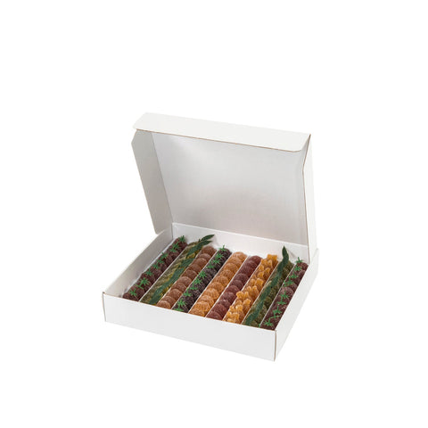 Assorted Jag Couture London - New York pâte de fruits in colorful whole fruit shapes on a white background.