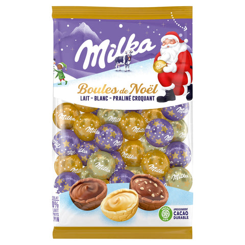 Milka Christmas baubles in a bag featuring milk, white, and crispy praline flavors, by Jag Couture London - New York.