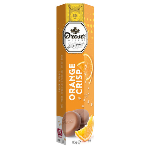 Milk chocolate orange crisp pastilles in a tube, by Jag Couture London New York, shown in a close-up image.