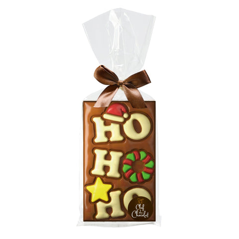 Decorated milk chocolate bar with Ho Ho Ho design in a clear cello bag, by Jag Couture London - New York.
