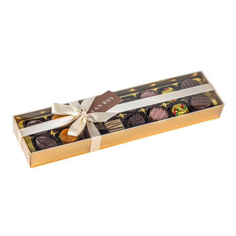 Assorted Belgian chocolates in gold box with acetate lid and ribbon, luxury confectionery by Jag Couture London - New York.