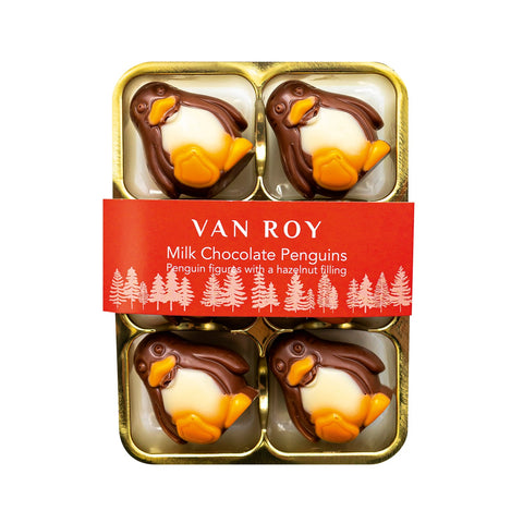 Milk chocolate penguin figures with hazelnut filling in cello pack by Jag Couture London New York, showcasing detailed chocolate penguins.