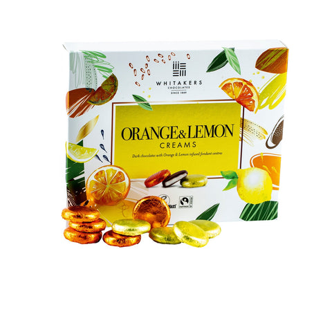 Whitakers foiled dark chocolate orange and lemon creams in a carton, featuring rich chocolates with citrus-flavored centers.