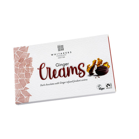 Dark chocolate covered ginger fondant creams in carton, by Jag Couture London - New York, shown in a neatly arranged box.