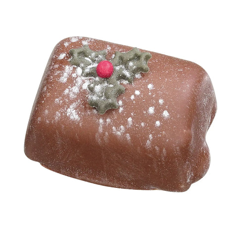 Milk chocolate Yule log filled with chocolate mousse by Jag Couture London New York, showing a sliced piece revealing the creamy filling.