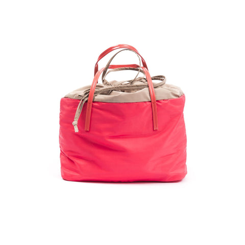 Jag Couture London byblos coral jewelry piece, featuring intricate design and vibrant coral color on a neutral background.
