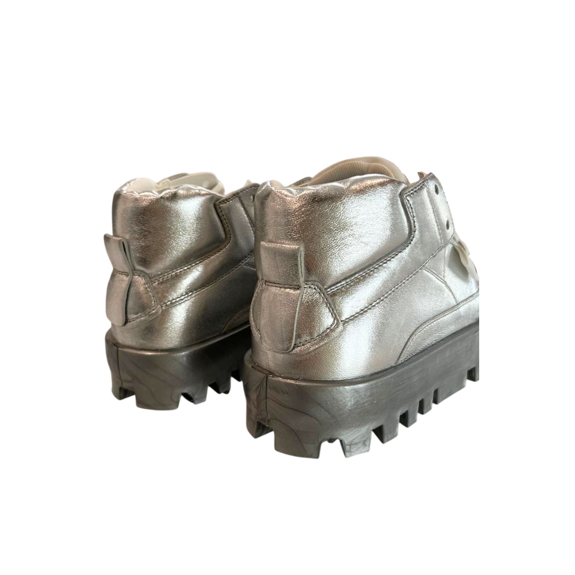 Silver jewelry piece from Jag Couture London New York, featuring intricate design and polished silver finish.