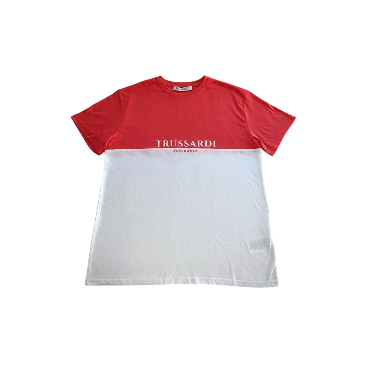 White and salmon Trussardi Beachwear TRU25MTS02 with stylish design, displayed on a model at the beach.