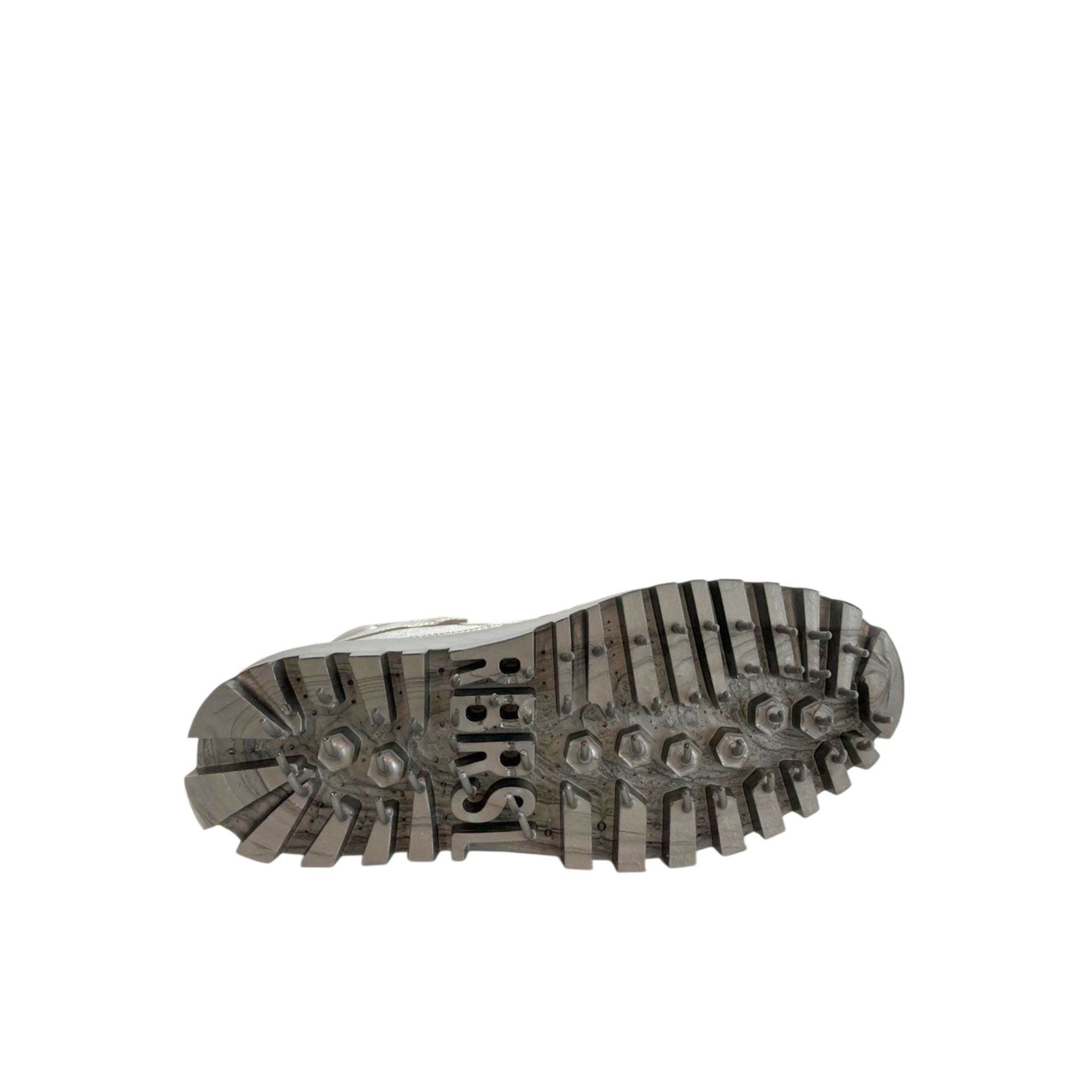 Silver jewelry piece from Jag Couture London - New York, featuring a stylish design with intricate details and a polished finish.