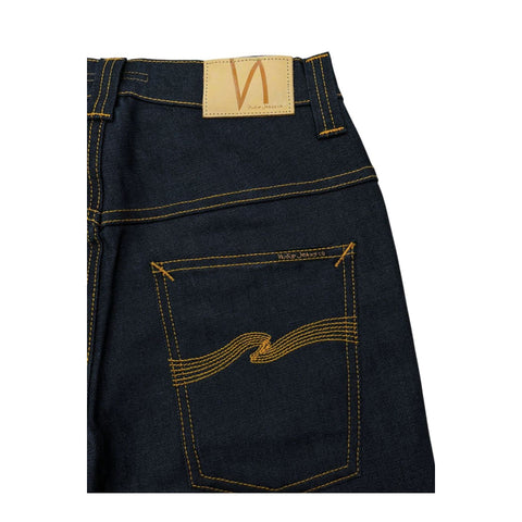 Nudie Jeans NJ4229 Tapeted BluNavy denim jeans with taper fit, shown on a hanger, featuring dark blue wash and subtle stitching details.