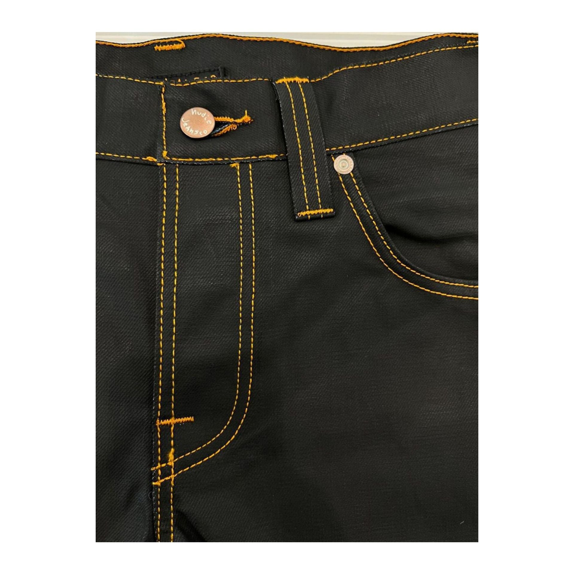 Nudie Jeans NJ2943_4GREMTIM NeroBlack denim jeans with classic fit, displayed on a model showcasing the stylish black denim design.