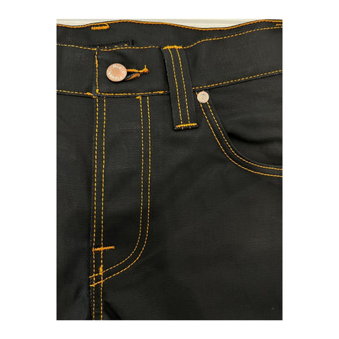 Nudie Jeans NJ2943_4GREMTIM NeroBlack denim jeans with classic fit, displayed on a model showcasing the stylish black denim design.