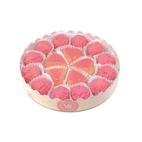 16cm round gift box of Jag Couture London Champagne truffles and caramel-filled blushed hearts, perfect for gifting.