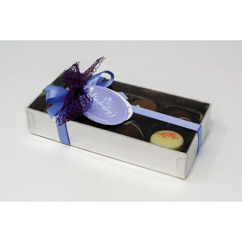 Eight handmade English chocolates and truffles in a silver gift box with a menu tag, by Jag Couture London - New York.